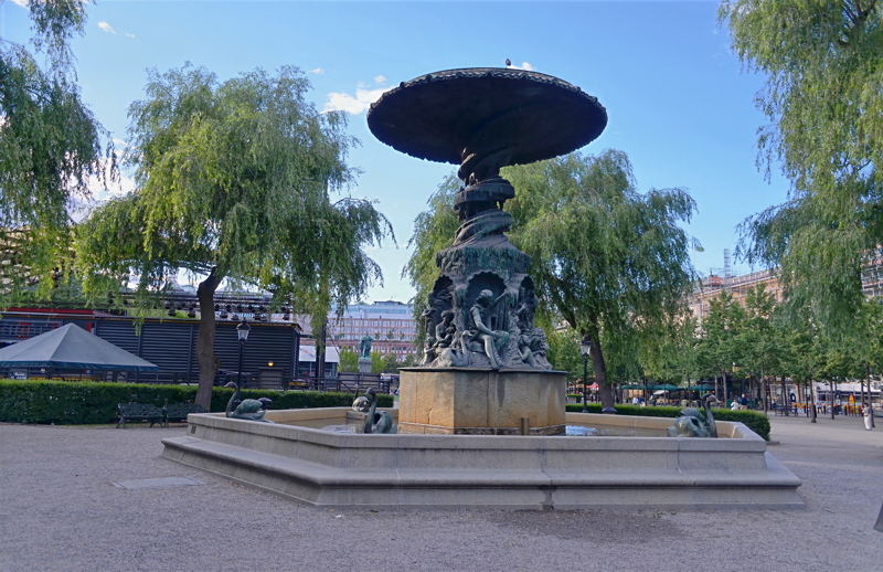 5 - The historic Molins Fountain located in Stockholm's Kungsträdgården park, featuring detailed bronze sculptures designed by Johan Peter Molin